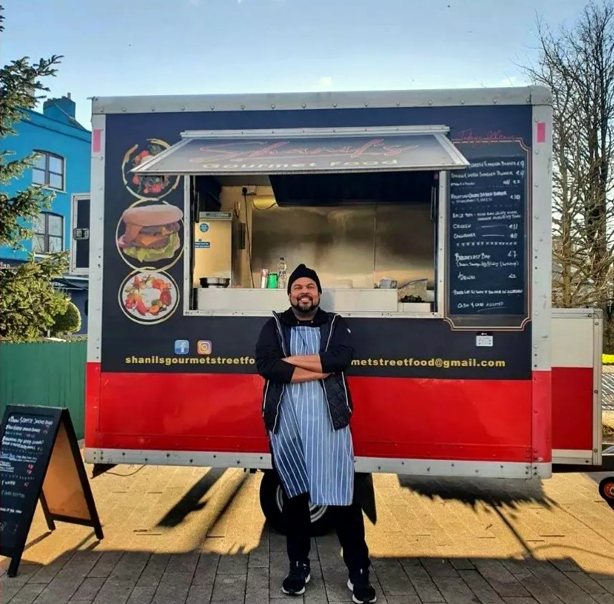Shanil standing in front of the food truck
